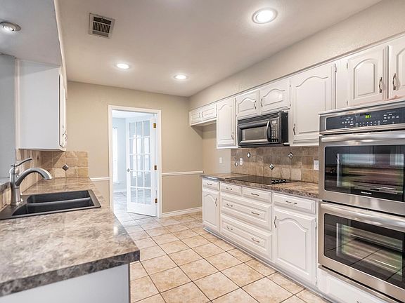 Partially open Galley Kitchen