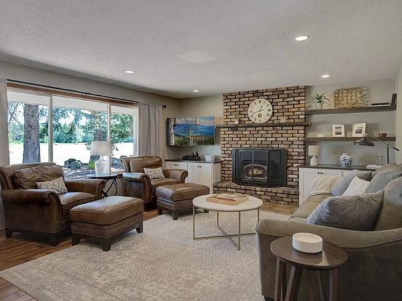 Spacious living space for all the family. Large picture windows throughout house bring in the warmth in the winter while the wood burning stove adds a pleasant touch.