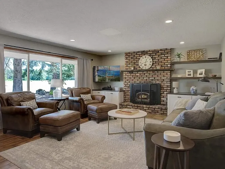Spacious living space for all the family. Large picture windows throughout house bring in the warmth in the winter while the wood burning stove adds a pleasant touch.