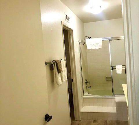 Owner's bath with separate toilet.