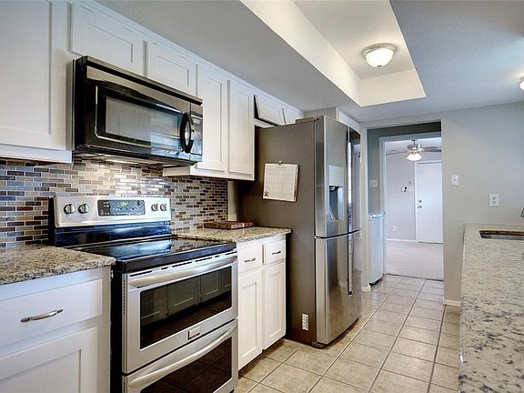 updated kitchen with granite, appliance and tile