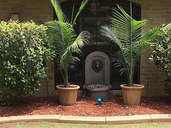 Front yard lion water fountain and planters