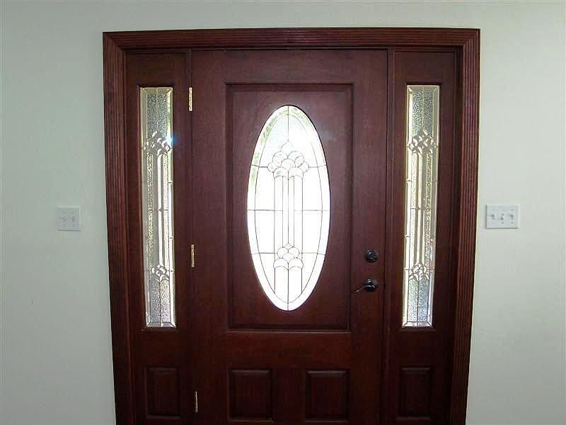 Gorgeous wood front door greets your guests!