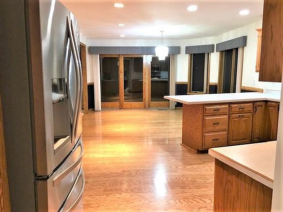 The dining area has direct access to the patio and raised flower gardens.