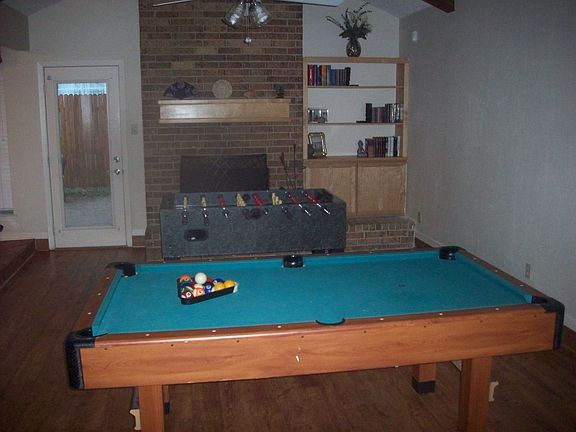 Game room with fireplace