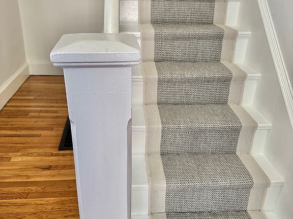 Freshingly finished floors, newly painted stairs and handsome new carpet runner.