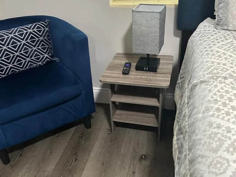 Chair with cushion, nightstand with lamp & space for your items