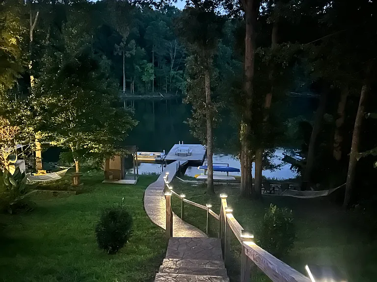 Solar powered light caps light the path leading down to the lake and private dock.