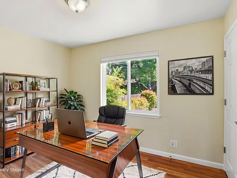 Bedroom staged as an office. Image digitally altered.