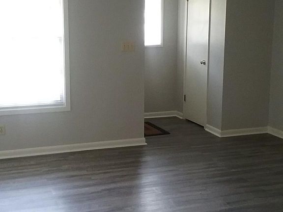 Living Room. Fresh Paint. Luxury Vinyl Driftwood Floors.