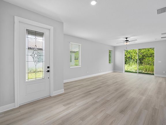 The family room has a sliding glass door that leads to the backyard