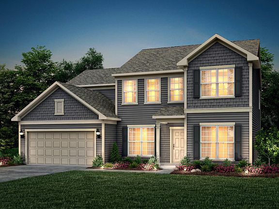 Wingate Exterior 2 features Hardie Board siding, shakes, covered front door and 2 car garage