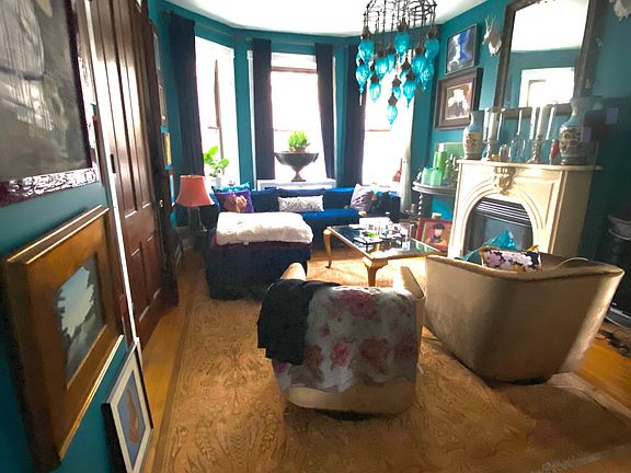 Sunny living room. (Lights are current tenants and will not be included with the rental.)