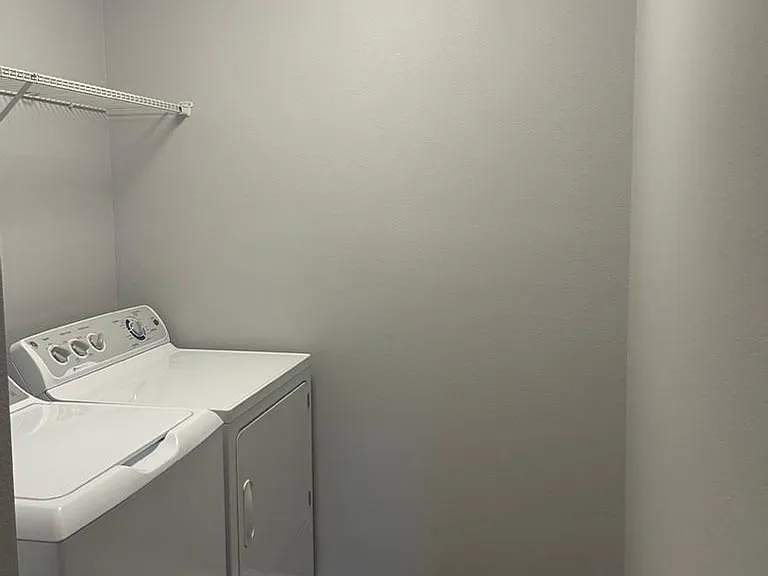 Washer and dryer in upstairs room near bedrooms