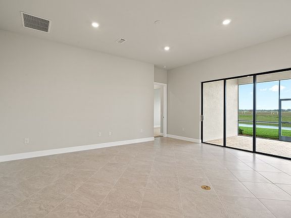 Spacious gathering room with sliding glass door to covered lanai