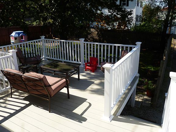 Spacious deck overlooking fenced-in back yard. 