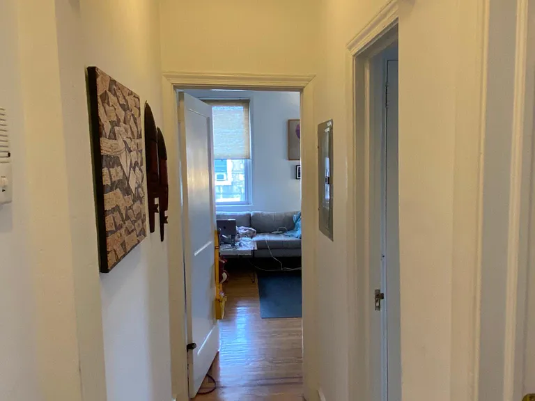 Entry way, lead to bathroom (on right) & living room (straight ahead).