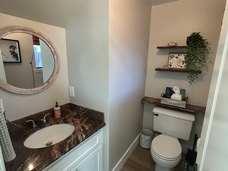 Updated 1/2 bathroom downstairs, conveniently separated from upstairs living quarters