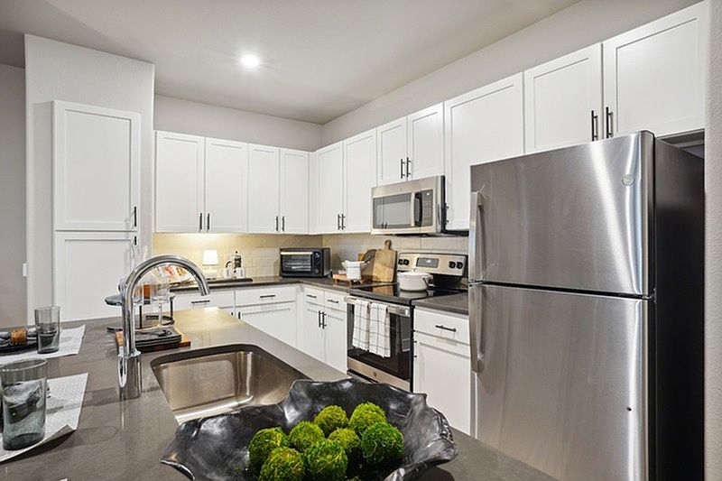 Luxe kitchen with stainless steel appliances and large island