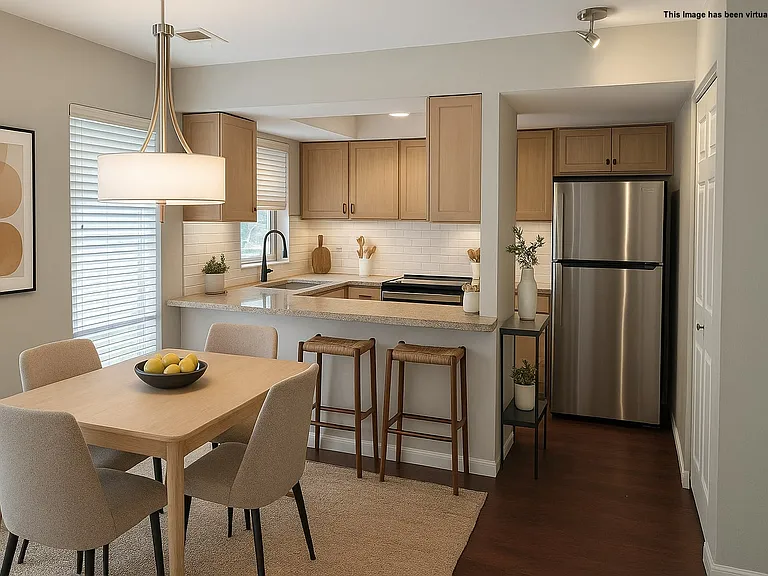 Staged Kitchen and Dining Area.