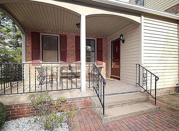 The front porch offers ample space for relaxing and entertaining