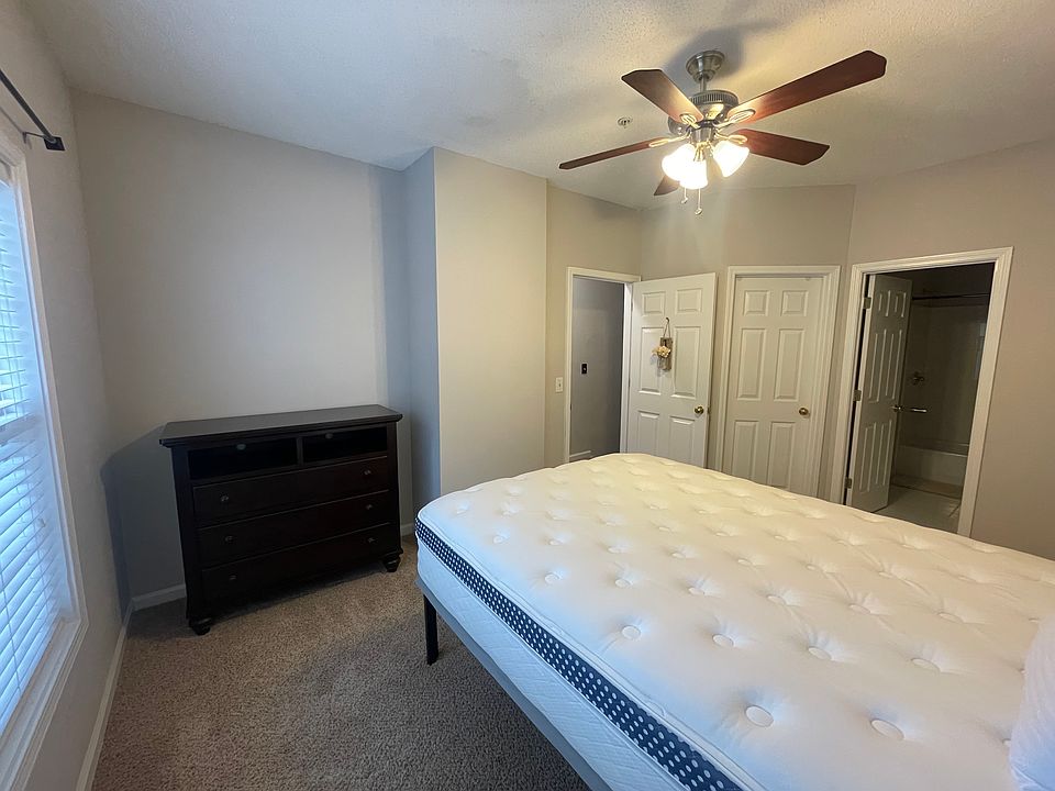 2nd bedroom with tv stand dresser