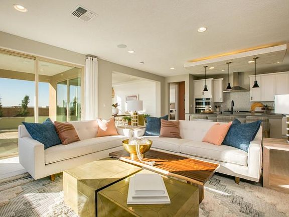 The gathering room opens to the kitchen and cafe, as well as the covered patio and backyard for indo