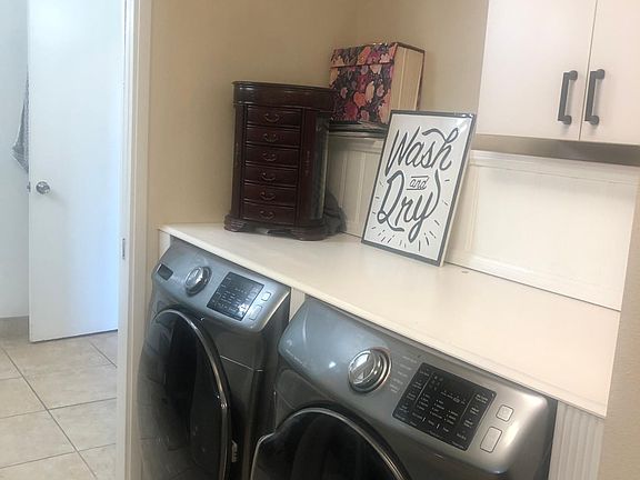 Laundry area within master bedroom. Very convenient!