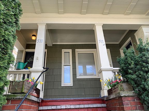 Come home to a porch with flower boxes!