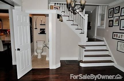 First floor half bath and open Staircase
						:
						This gorgeous entry has wonderful character with an oak open Staircase