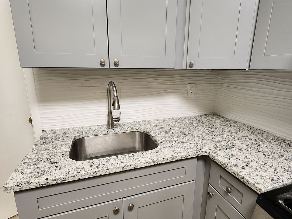 Brand new modern cabinetry and stone countertops.