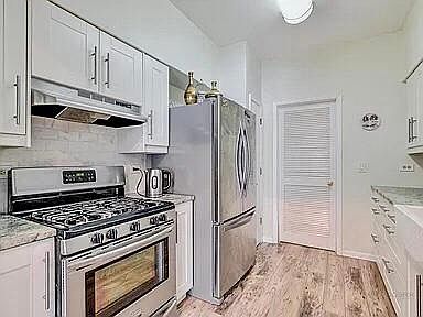 Kitchen with new ceiling lights and SS appliances