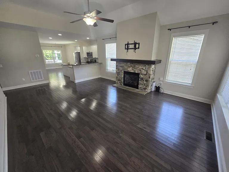 Living room, kitchen, and dining room offers a lovely open floor plan