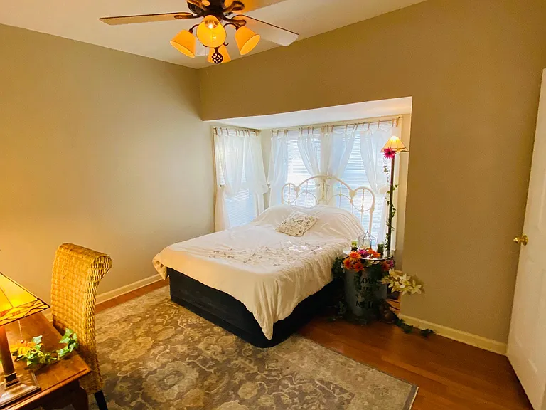 The Second bedroom is the largest of the three. It has a ceiling fan and Floor to Ceiling Bay window nook.