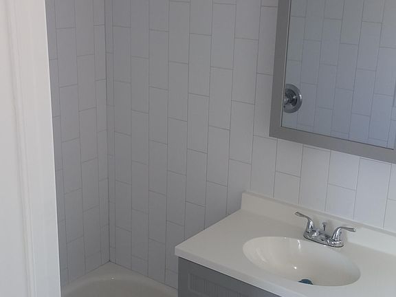 The left-hand side of the bathroom.