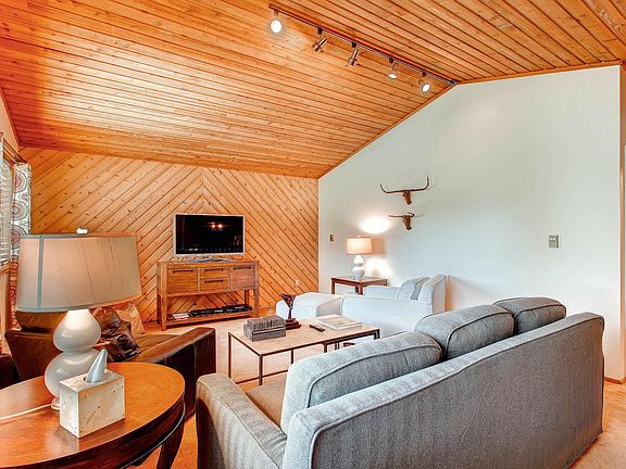 Living room has natural wood