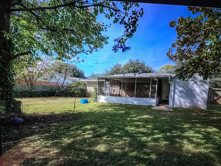 Backyard showing garden room/storage shed angle