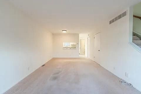 Living room and dining room looking toward the kitchen