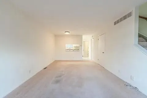Living room and dining room looking toward the kitchen