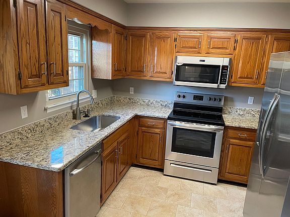 Kitchen with new appliances and granite countertops