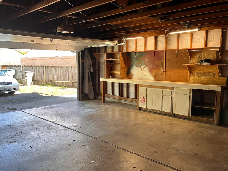 two car garage with workbench and W/D hookups