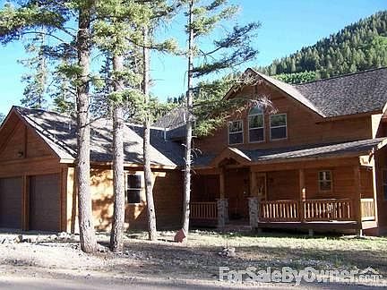 Street Side : Street side - mountain backdrop and 2 car heated garage
