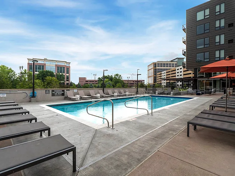 Relax poolside on comfortable lounge chairs, the perfect spot to enjoy sunny days.