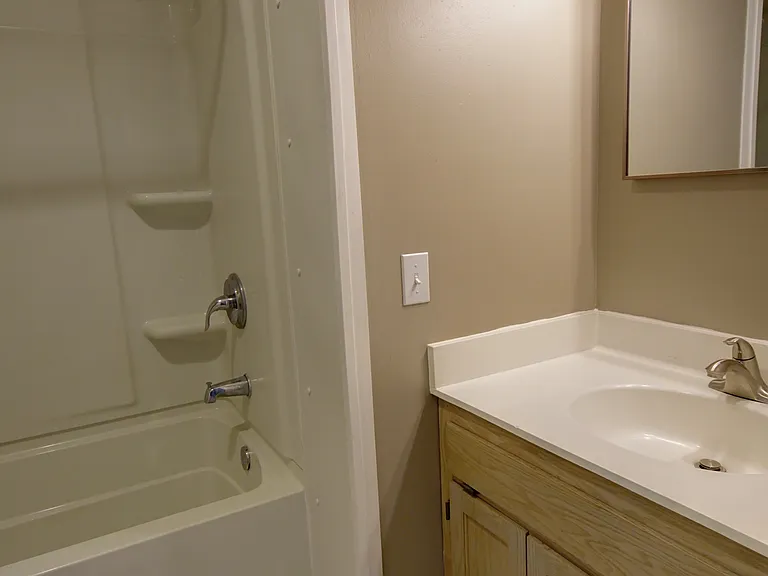 Bathroom with tile located upstairs near all three bedrooms
