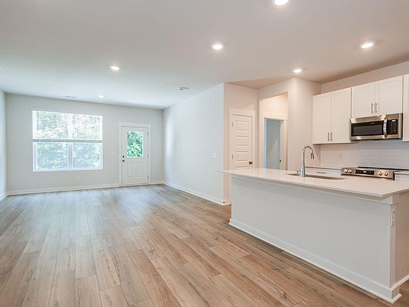 Living Room/Kitchen view w/Back Patio access door