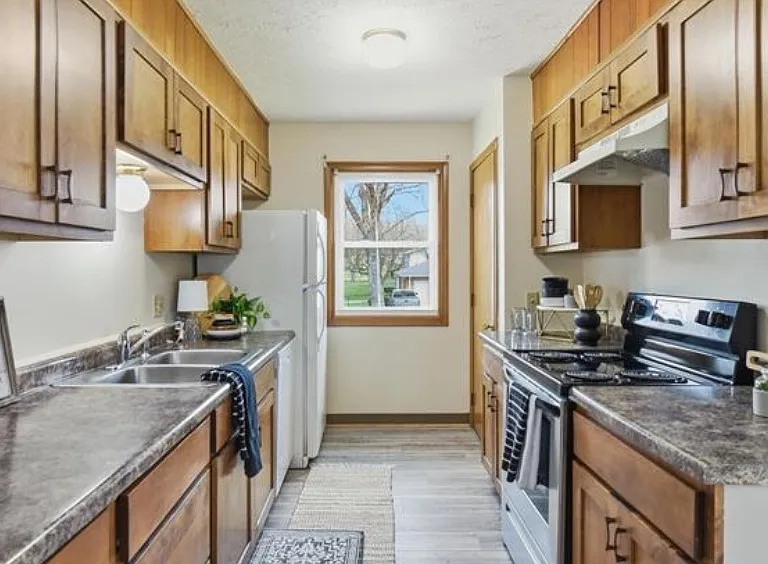 Kitchen with new refrigerator and microwave
