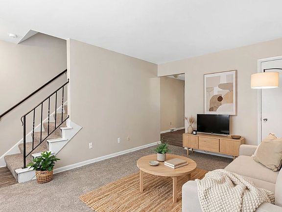 Bright and comfortable living room featuring an open layout that makes the space feel warm and welcoming.