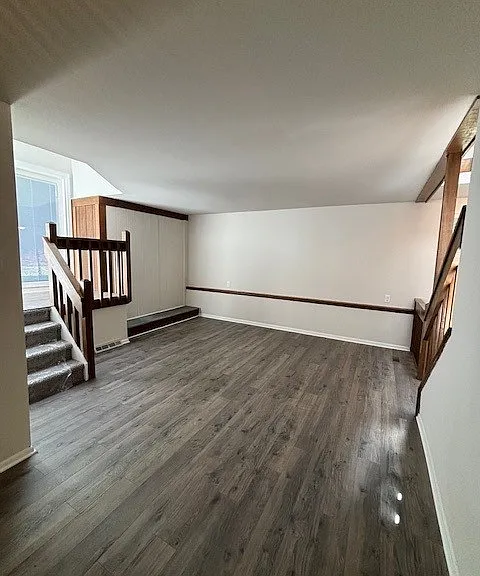 Second Floor Living Room Area with Access to Patio, Dining Room and Kitchen