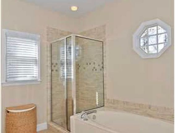 Master bath with double vanity and large garden tub
