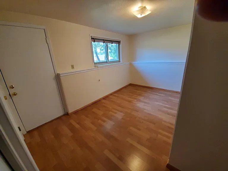 Laundry, exercise room, or 4th bedroom with door to yard.